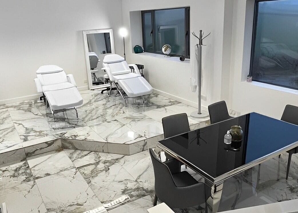 Luxurious treatment suite at Atlas Cosmetics Clinic - Lytham St Annes, Lytham St Anne’s, England, GB with elegant marble flooring.