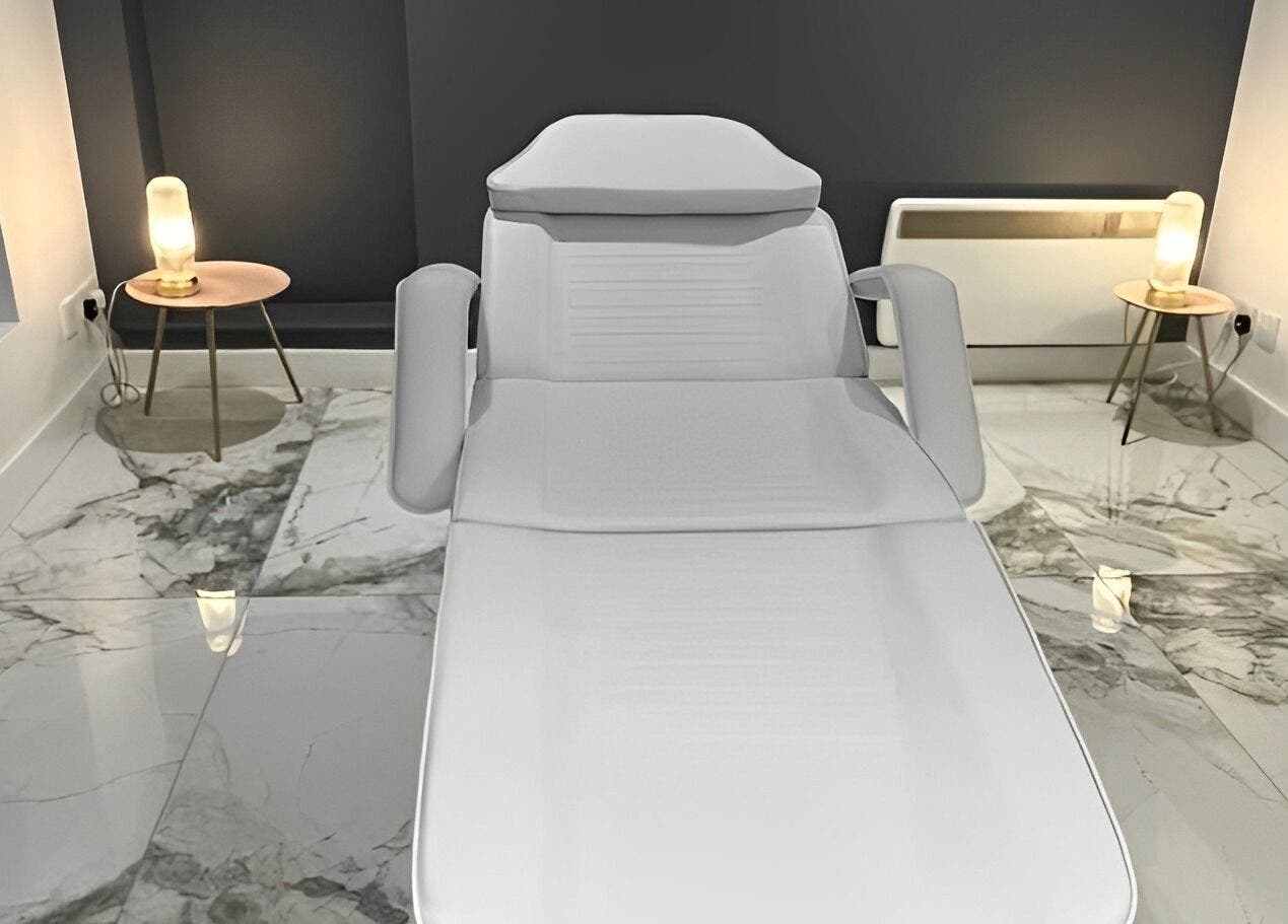 A luxurious treatment room at Atlas Cosmetics Clinic - Lytham St Annes, featuring modern furniture in Lytham St Anne’s, England, GB.