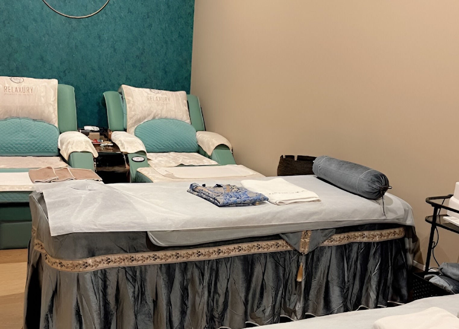 Luxury spa chairs and massage table at Relaxury, Auckland, Auckland, NZ, offering a serene and relaxing ambiance.