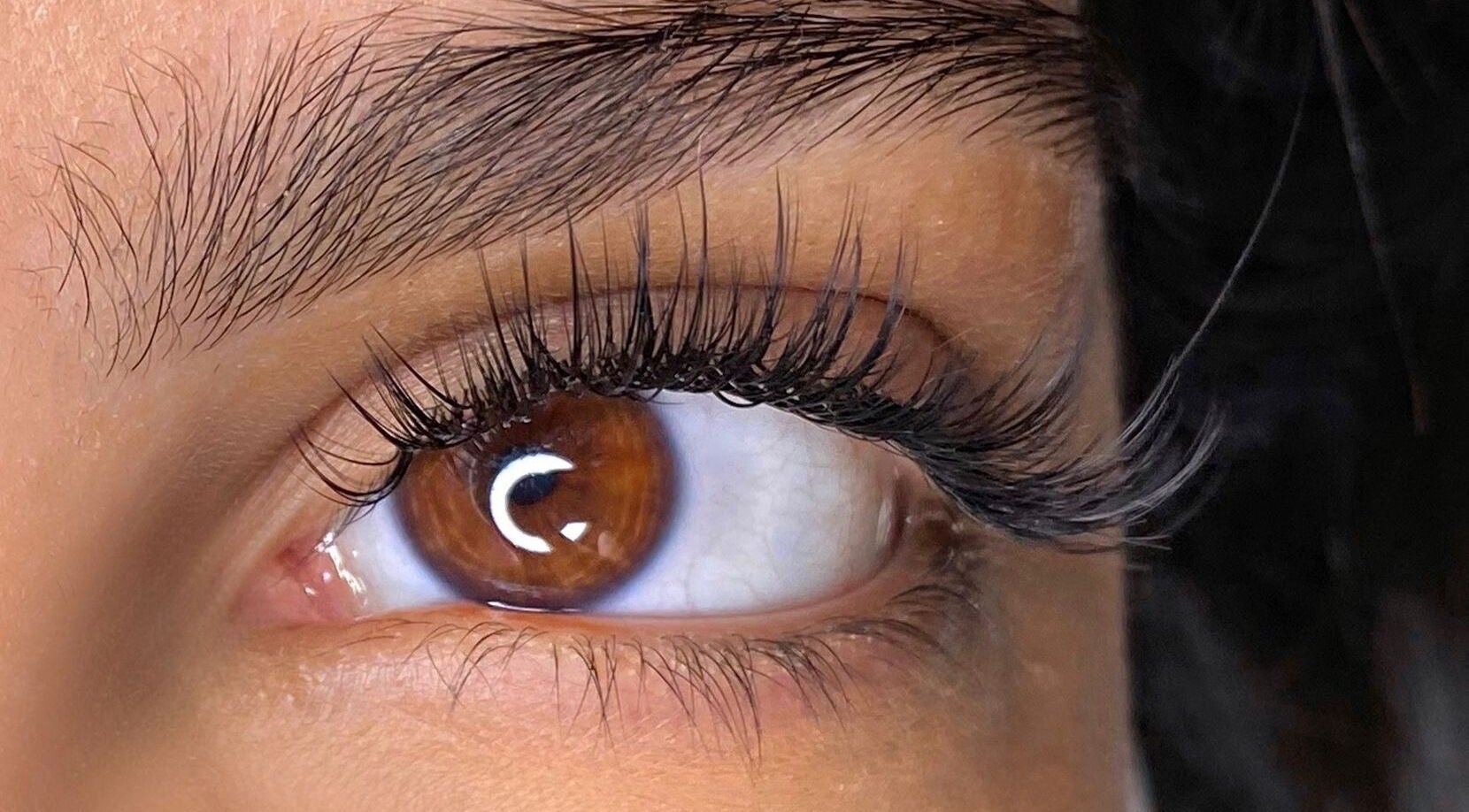 Close-up of expertly styled eyelashes at Beauty Hunters The Pearl, Doha, QA.