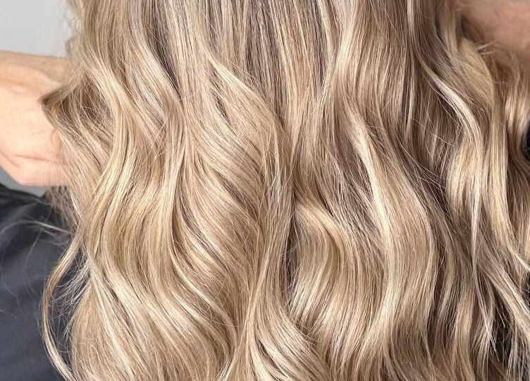 Elegant blonde waves styled at Beauty Hunters The Pearl, Doha, QA.