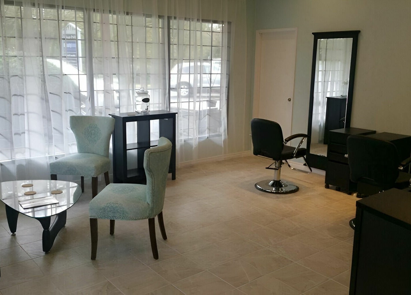 Tranquil ambiance at Beauty Time Salon and Spa in Vancouver, British Columbia, CA, showcasing elegant chairs and mirrors.