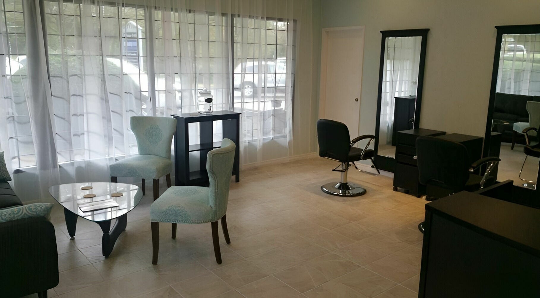 Tranquil ambiance at Beauty Time Salon and Spa in Vancouver, British Columbia, CA, showcasing elegant chairs and mirrors.