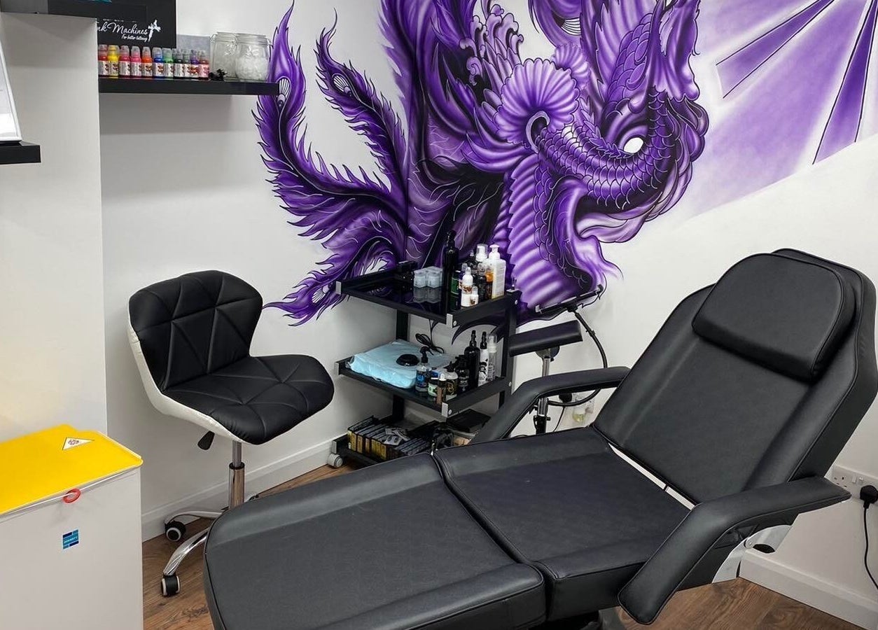 Artistic spa chair setup at The Avalon Rooms, Witney, England, GB, featuring a vibrant dragon mural.