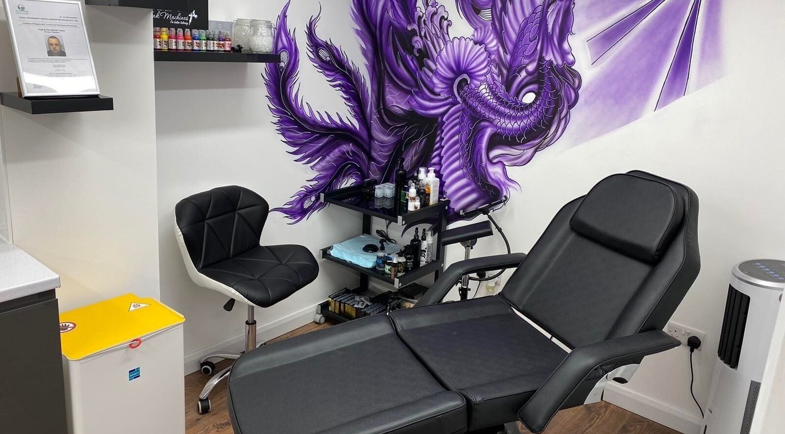 Artistic spa chair setup at The Avalon Rooms, Witney, England, GB, featuring a vibrant dragon mural.
