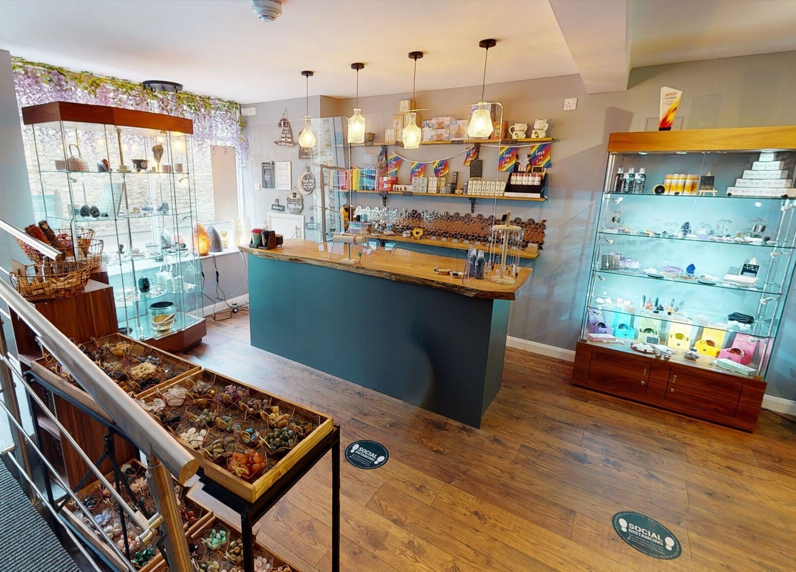 Welcoming interior of The Avalon Rooms, Witney, England, GB with elegant display cases and warm lighting.