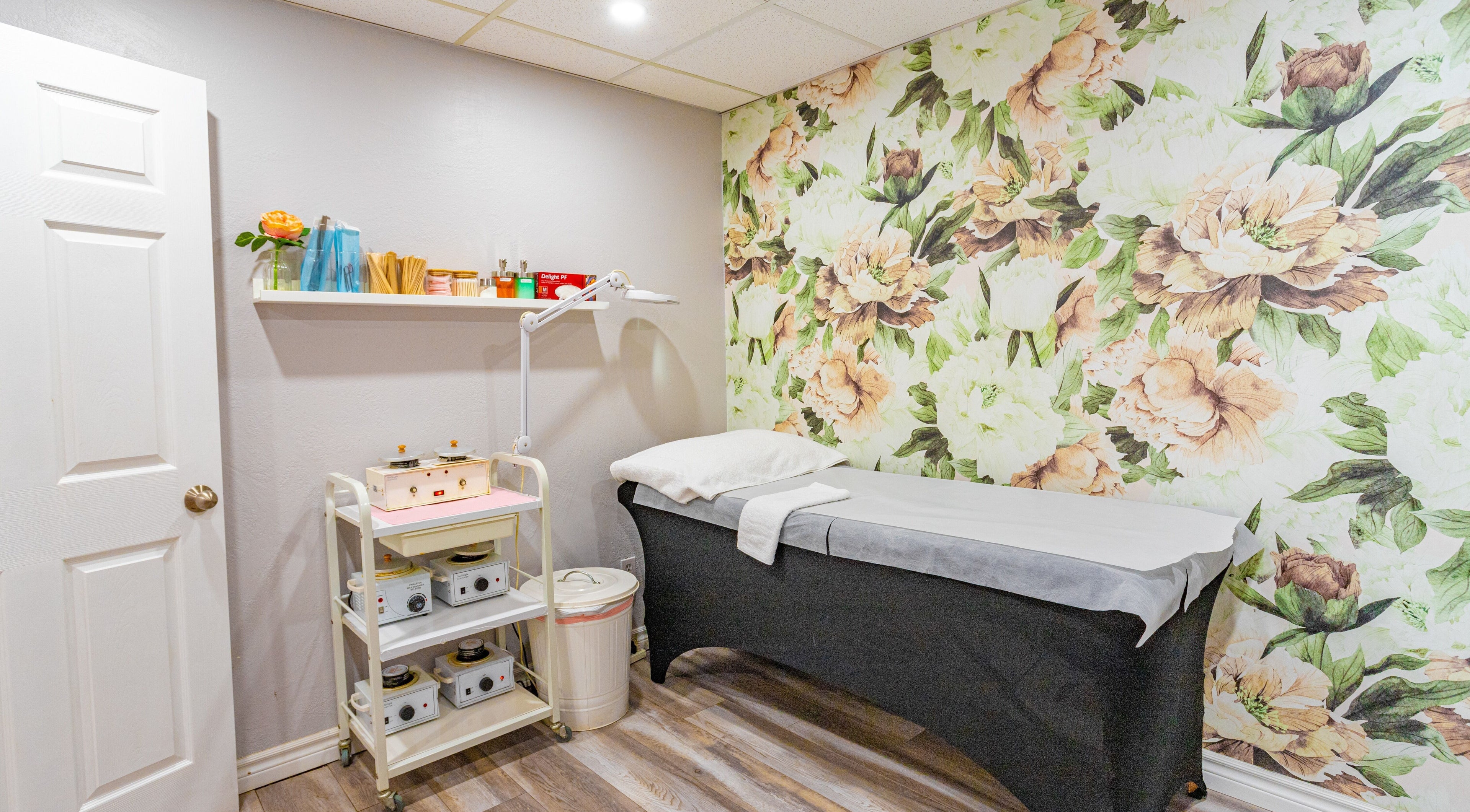 Cozy beauty treatment room with floral accents at The Beauty Wax Room Toronto, Toronto, Ontario, CA.