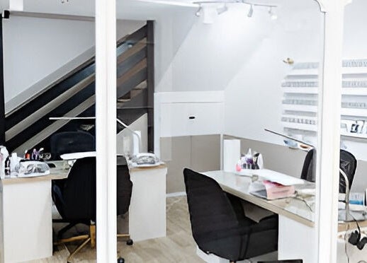 Contemporary nail salon interior at Justinas Nails, Truro, England, GB featuring modern workstations.