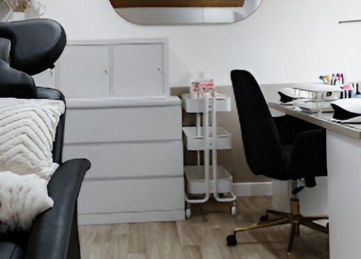 Elegant nail salon setup at Justinas Nails in Truro, England, GB. Modern chair, desk, and accessories.
