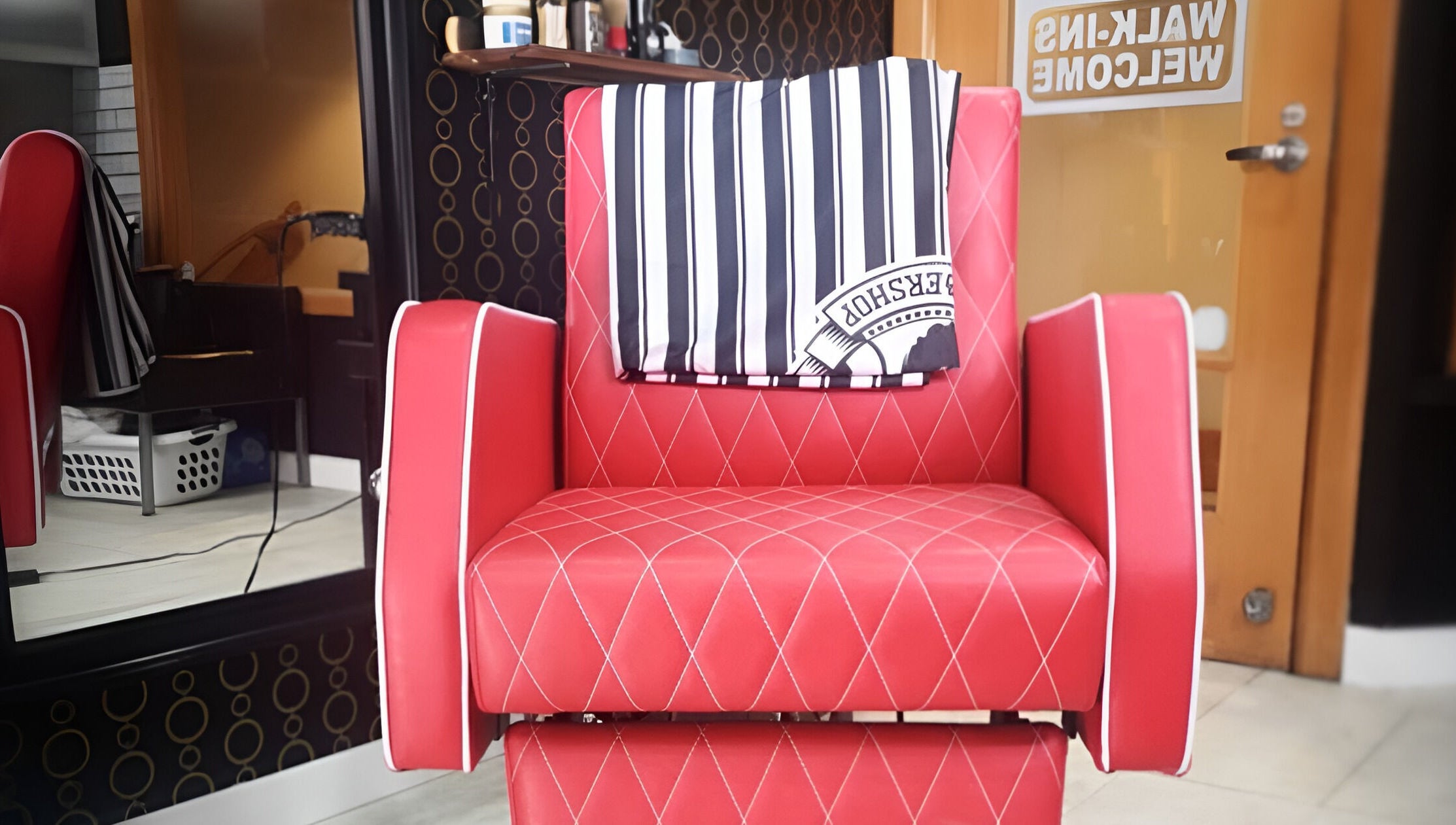 Red barber chair at Blakkloud, Banff, Alberta, CA welcoming walk-in clients.