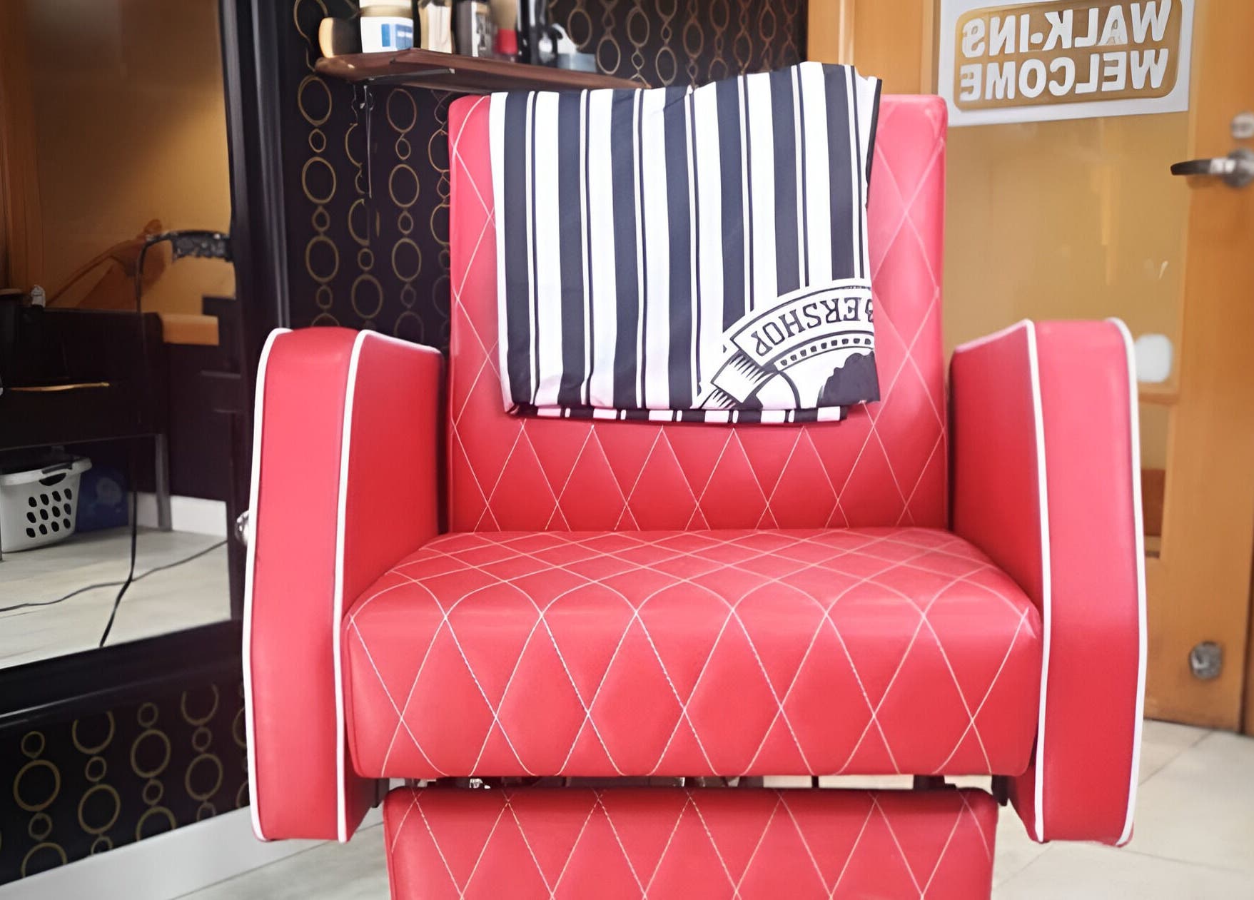 Red barber chair at Blakkloud, Banff, Alberta, CA welcoming walk-in clients.