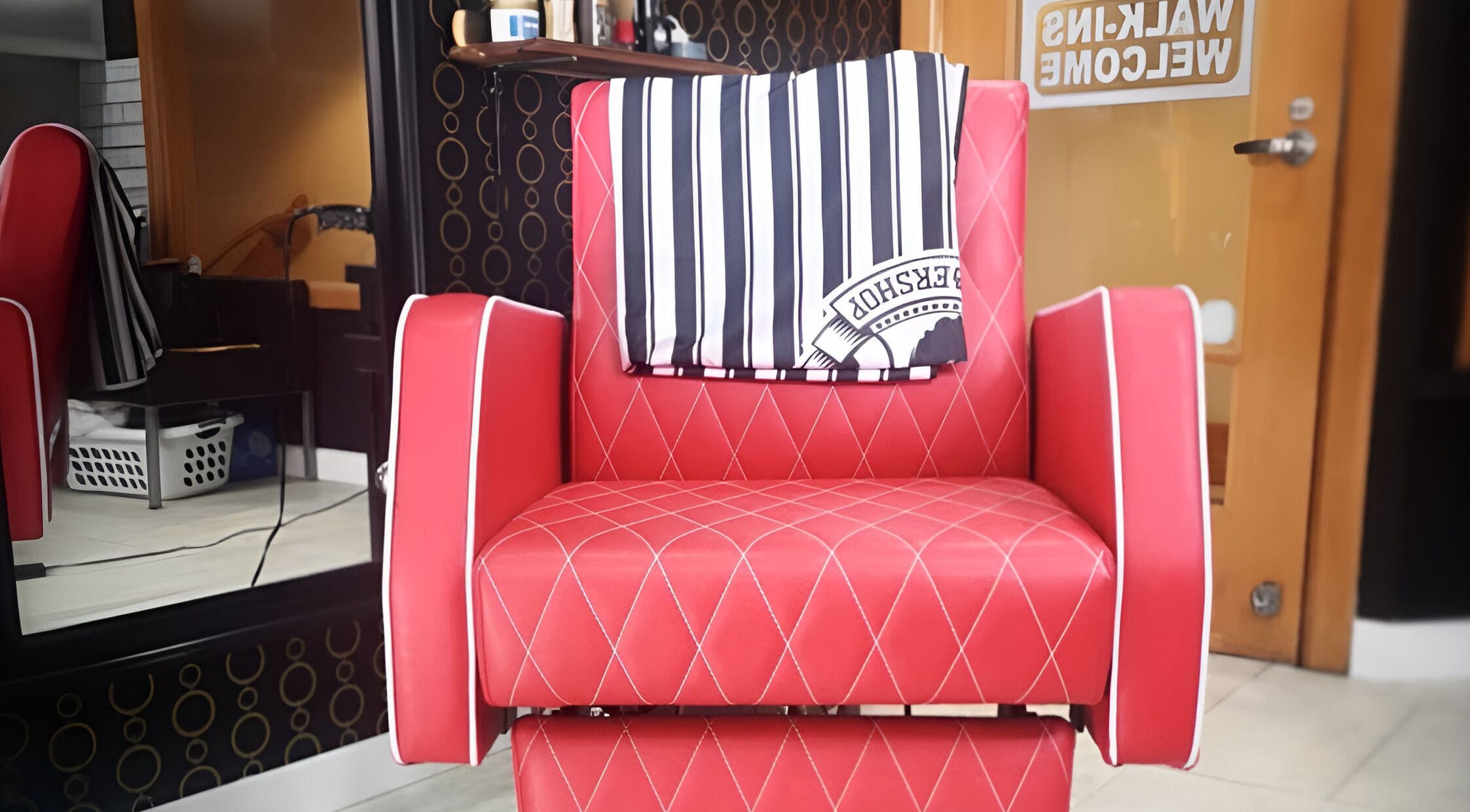 Red barber chair at Blakkloud, Banff, Alberta, CA welcoming walk-in clients.