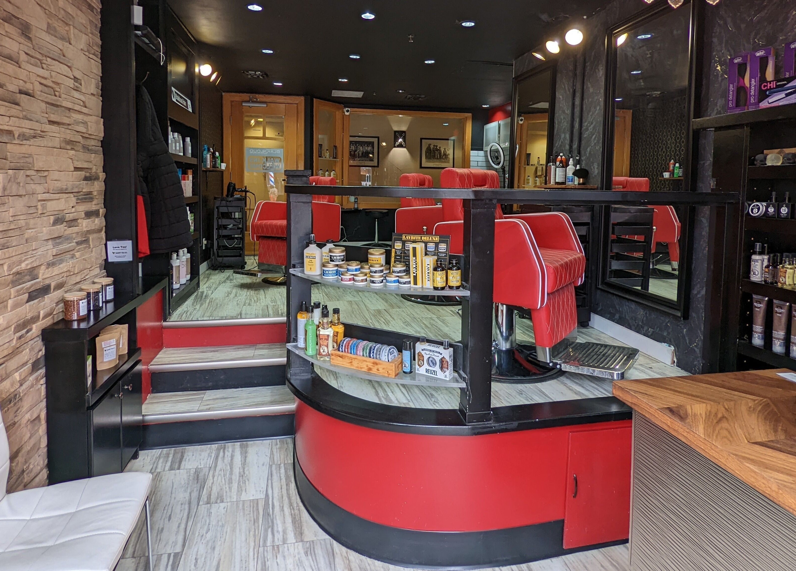 Stylish barber chairs and products at Blakkloud, Banff, Alberta, CA, creating a modern grooming vibe.