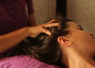 Head massage at Yogi Spa in Bali, Bali, ID, enhancing relaxation and wellness for a rejuvenating experience.