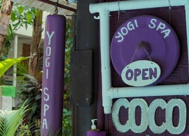 Purple Yogi Spa sign at Bali, Bali, ID entrance showcasing a welcoming atmosphere.