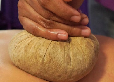 Herbal massage therapy at Yogi Spa, Bali, Bali, ID, offering relaxation and rejuvenation.