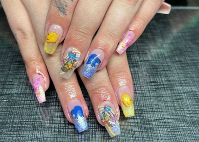 Vibrant nail art with cartoon designs at Tegan Maree Beauty, Orange, New South Wales, AU.