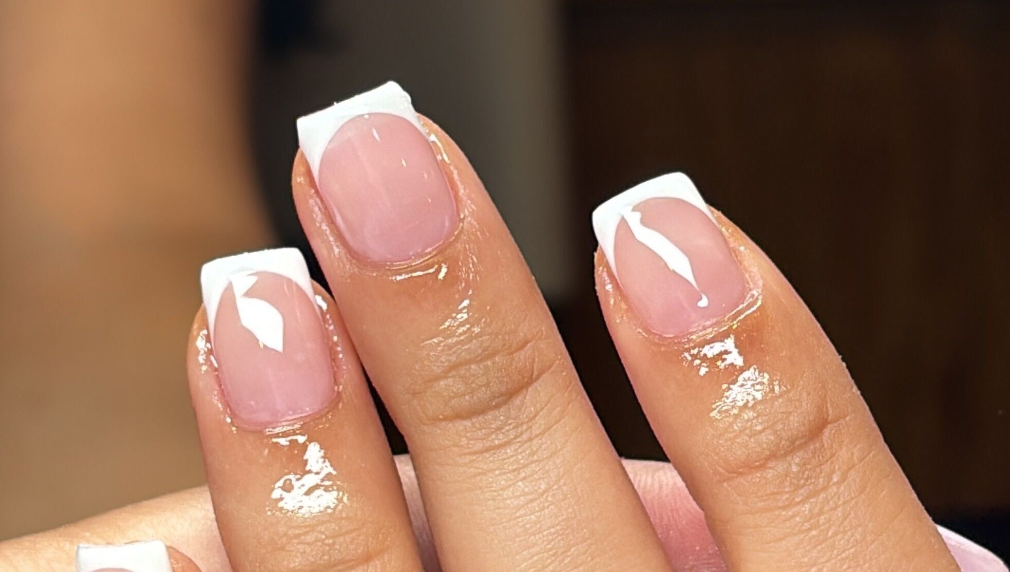Elegant French manicure nails by Slayed by NHI in Glen Mills, Pennsylvania, US, showcasing glossy nail art.