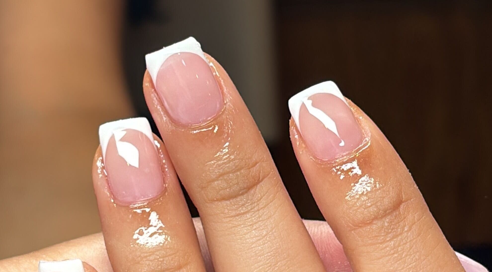 Elegant French manicure nails by Slayed by NHI in Glen Mills, Pennsylvania, US, showcasing glossy nail art.