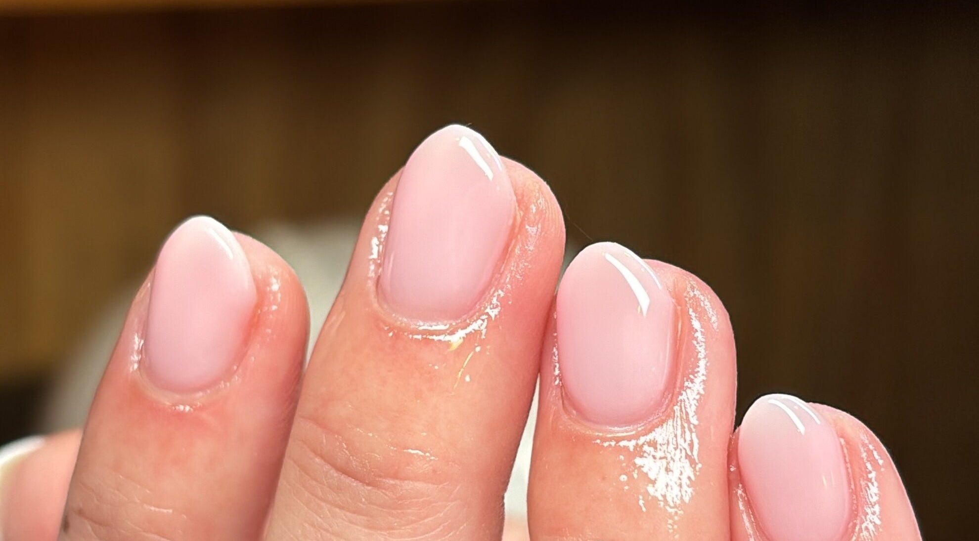 Close-up of glossy pink manicure at Slayed by NHI, Glen Mills, Pennsylvania, US.