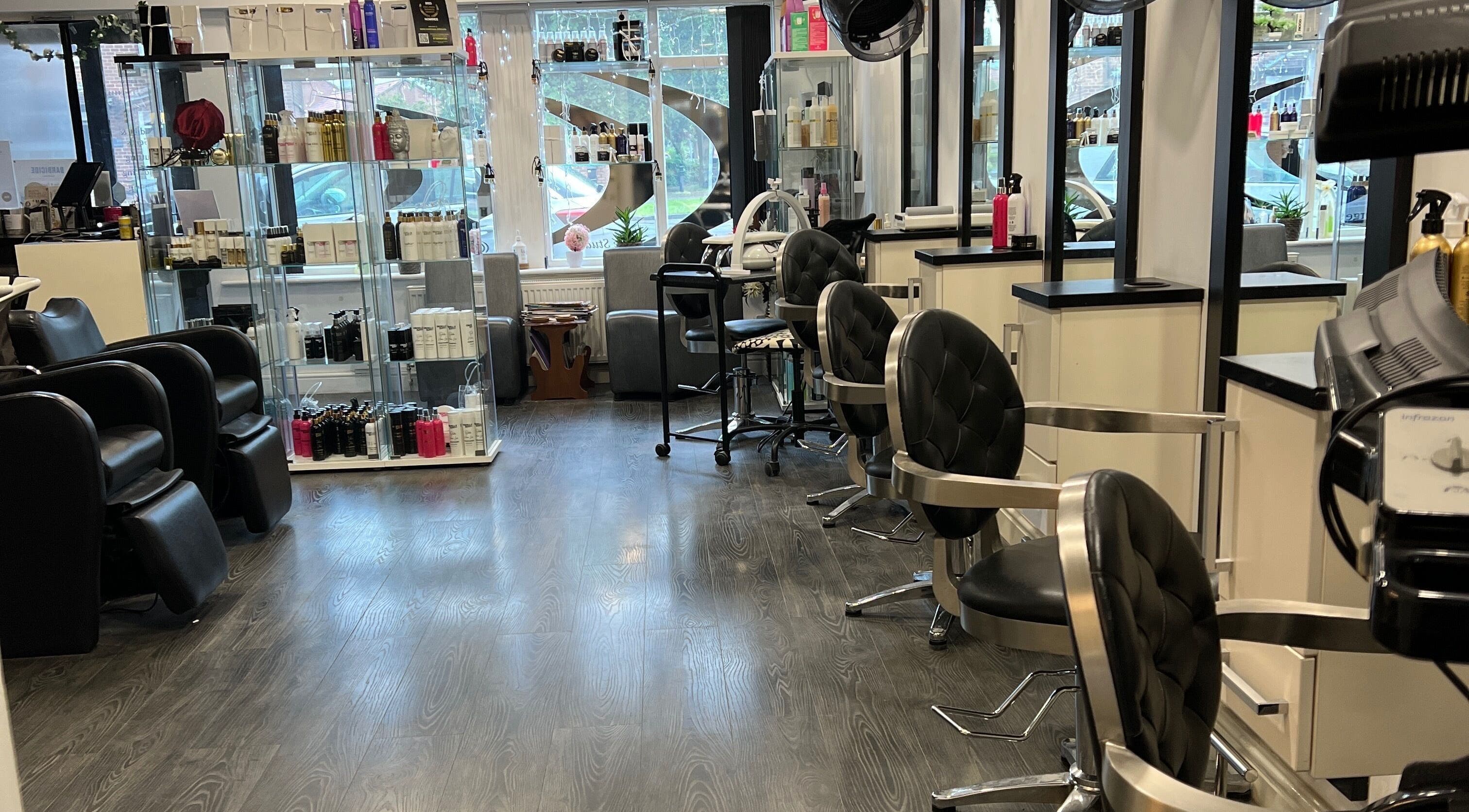 Modern salon interior at Orgella Hair & Beauty, Easingwold, England, GB with stylish seating and product displays.