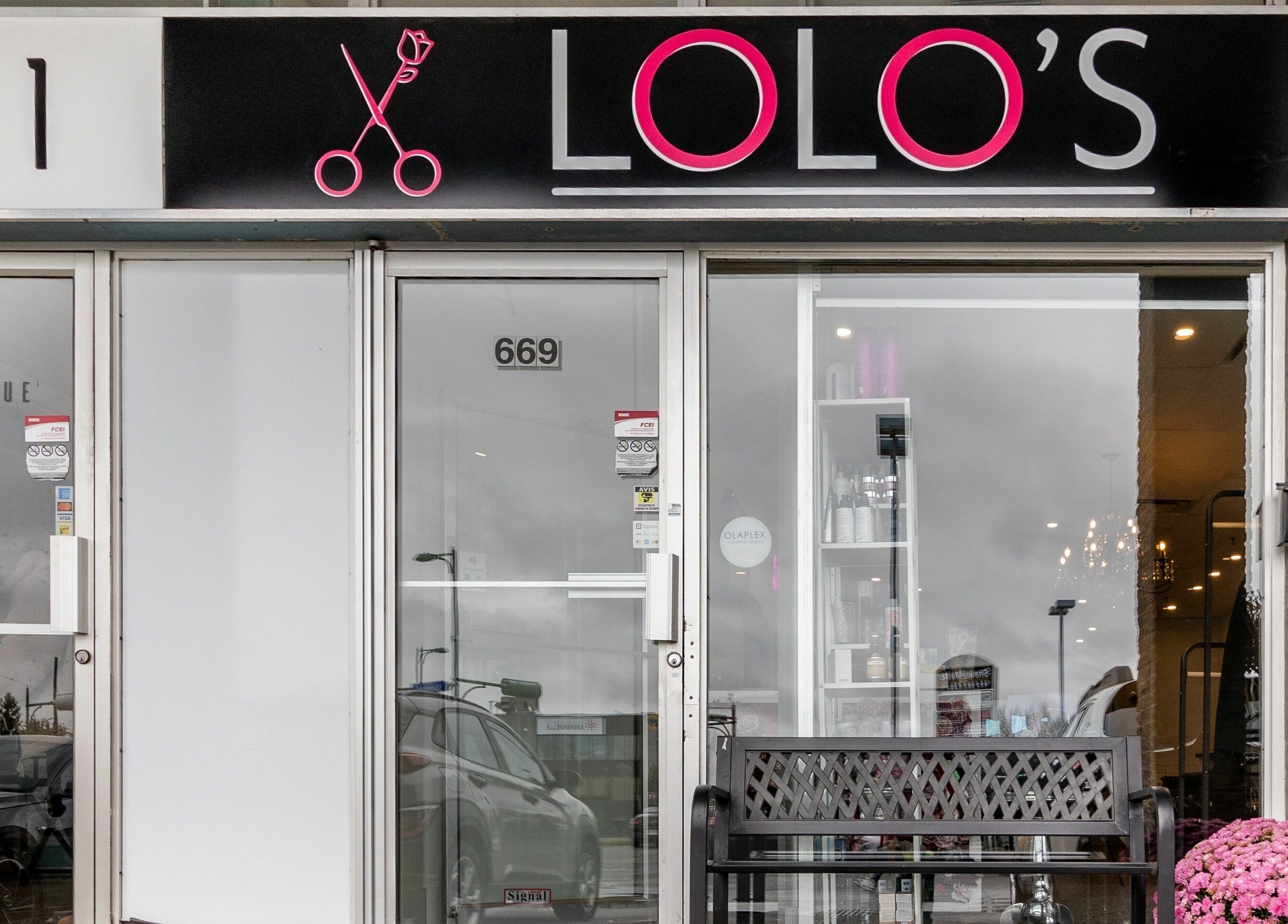 Entrance of Lolo's Salon in Laval, Québec, CA showcasing elegant design and vibrant decor.