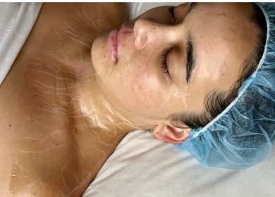 Close-up of facial treatment at That Glow, Melbourne, Victoria, AU. Woman with gel mask and head cover.