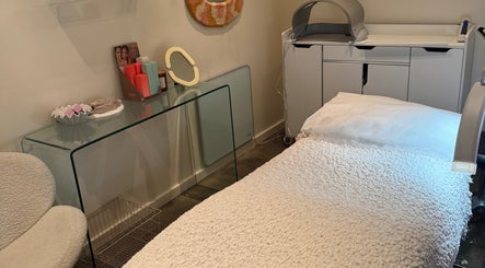 Tranquil treatment room at That Glow, Melbourne, Victoria, AU with modern decor and skincare products.