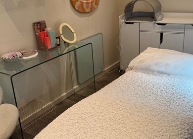Tranquil beauty treatment room at That Glow, Melbourne, Victoria, AU with a plush bed and stylish decor.