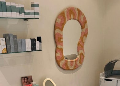 Stylish beauty nook at That Glow in Melbourne, Victoria, AU with unique mirror and skincare products.