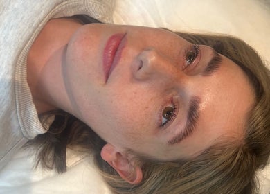 Relaxed woman enjoying soothing treatment at That Glow, Melbourne, Victoria, AU. Perfect unwinding retreat.
