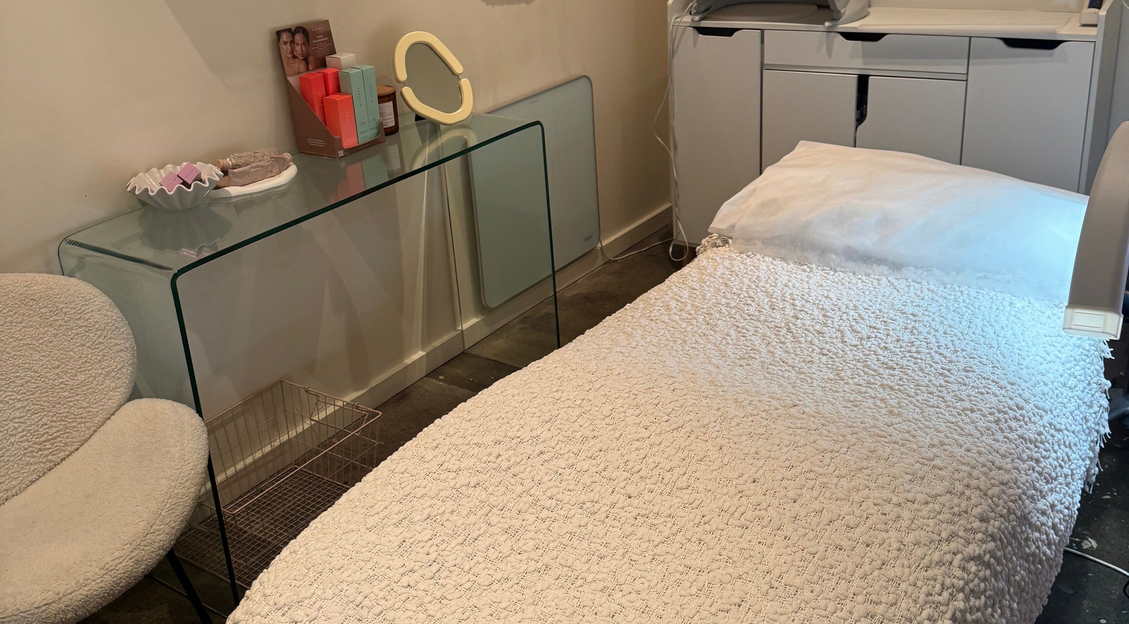 Cozy treatment room at That Glow, Melbourne, Victoria, AU with plush bed and elegant decor.