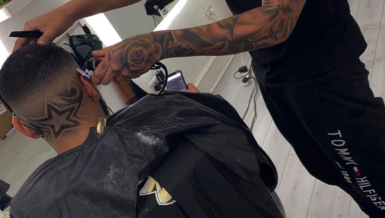 Intricate star hair design at 5 Star Barbers - Jay, Erith, England, GB, showcasing skilled barbering.
