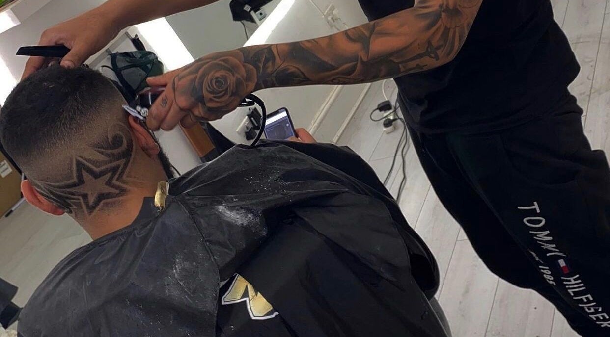 Intricate star hair design at 5 Star Barbers - Jay, Erith, England, GB, showcasing skilled barbering.
