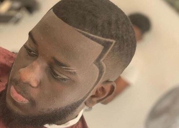 Sharp haircut style at 5 Star Barbers - Jay in Erith, England, GB showcasing precision fades.