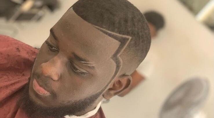 Sharp haircut style at 5 Star Barbers - Jay in Erith, England, GB showcasing precision fades.