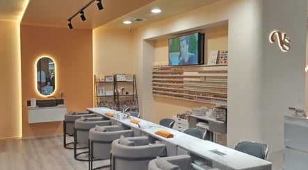 Chic interior of Vivi Salon Innaloo, a beauty haven in Innaloo, Western Australia, AU, with plush seating and products.