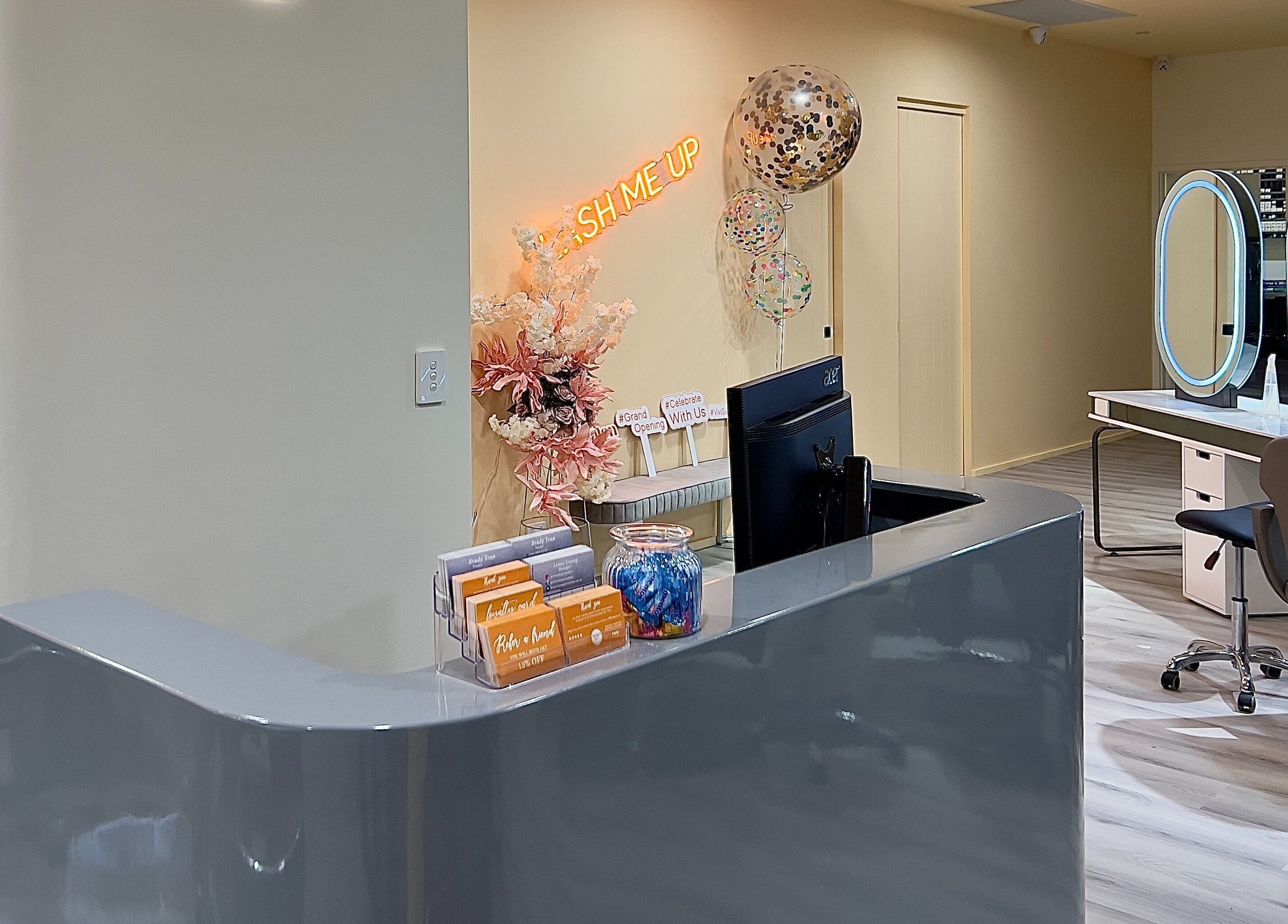 Reception at Vivi Salon Innaloo, Western Australia, AU, featuring sleek counters and elegant decor.