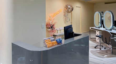 Reception at Vivi Salon Innaloo, Western Australia, AU, featuring sleek counters and elegant decor.