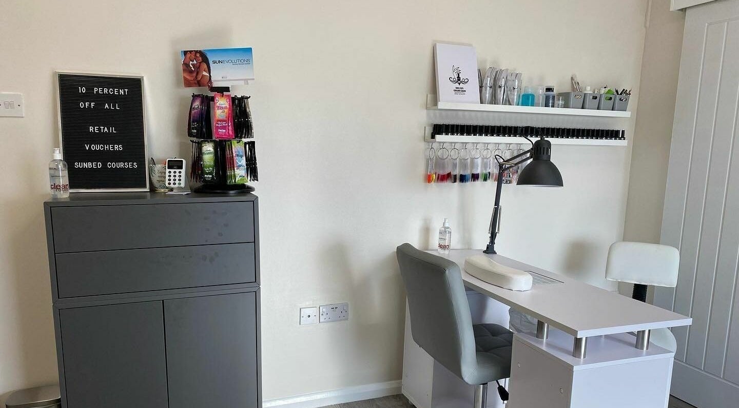 Nail treatment station at MRD Hair, Beauty and Aesthetics, Mulbarton, England, GB, showcasing nail polish collection.