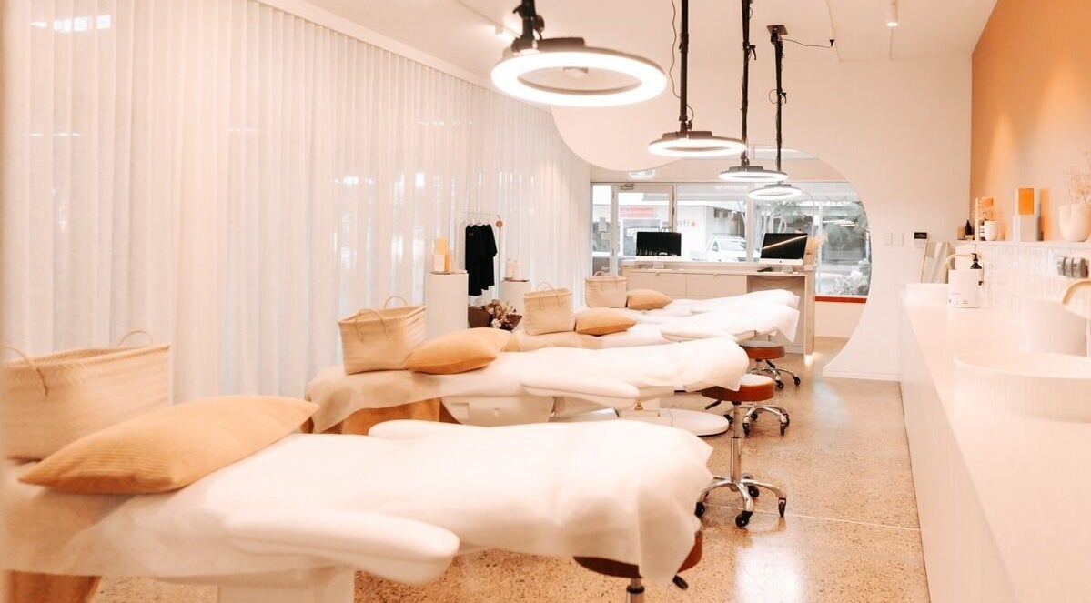 Elegant treatment beds at Mediluxe | Cleveland, Cleveland, Queensland, AU, lit by soft ambient lighting.
