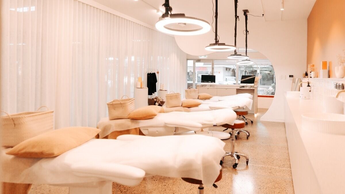 Elegant treatment beds at Mediluxe | Cleveland, Cleveland, Queensland, AU, lit by soft ambient lighting.