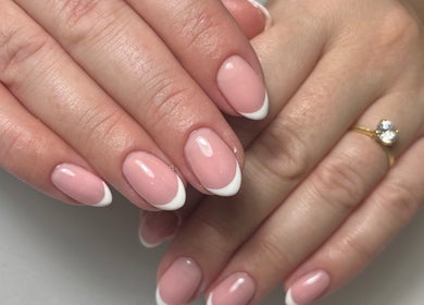 French manicure nails by By Melanie in Solihull, England, GB, featuring a natural pink base with white tips.