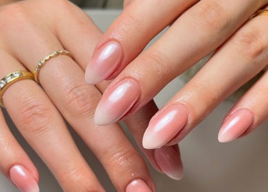 Elegant pink almond-shaped nails at By Melanie, Solihull, England, GB, showcasing exquisite manicure artistry.