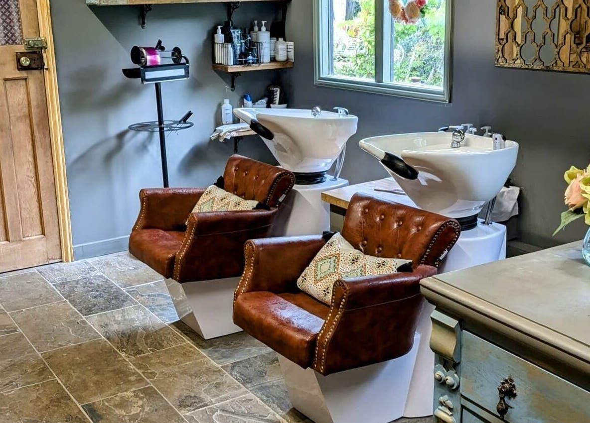 Elegant wash stations and leather chairs at The Mane House, Biddenden, England, GB.