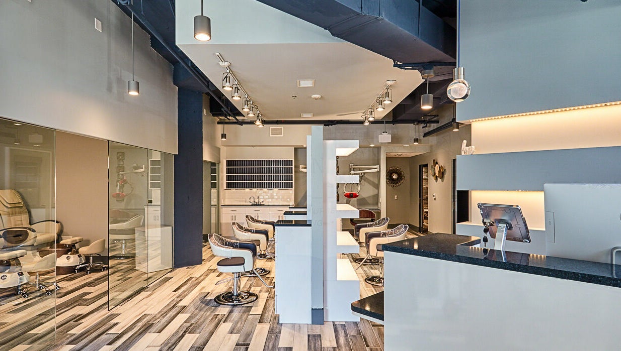 Modern interior of Infinity Spa Nails in Reston, Virginia, US, featuring stylish chairs and sleek design.