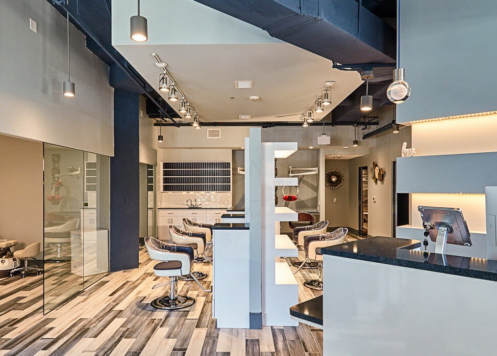 Modern interior of Infinity Spa Nails in Reston, Virginia, US, featuring stylish chairs and sleek design.