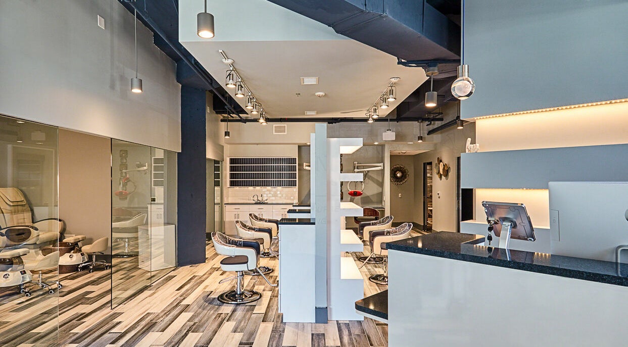 Modern interior of Infinity Spa Nails in Reston, Virginia, US, featuring stylish chairs and sleek design.