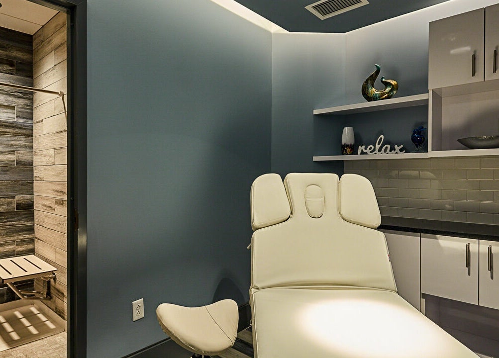 Serene treatment room at Infinity Spa Nails in Reston, Virginia, US, featuring a comfortable spa chair.