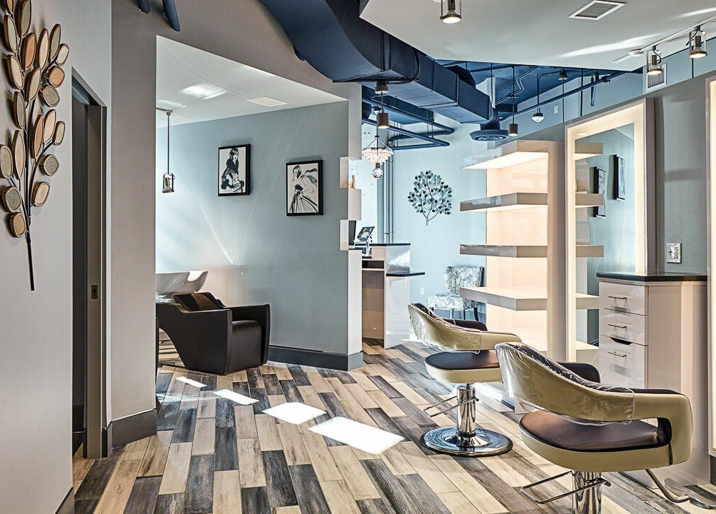 Modern interior of Infinity Spa Nails in Reston, Virginia, US featuring sleek chairs and elegant decor.